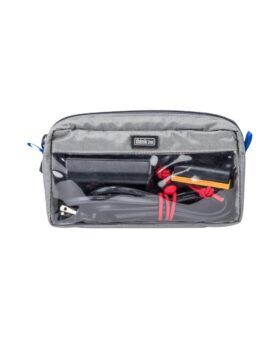 Grey nylon cable management pouch with clear mesh front, blue zipper pulls and cables inside, flat lay