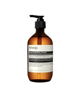 Geranium leaf body cleanser in an amber glass pump bottle with cream label, product shot