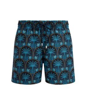Navy swim trunks with turquoise palm tree and turtle print and drawstring waist, flat lay