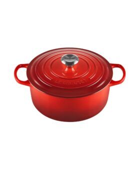 Cherry red Le Creuset enamelled cast iron round Dutch oven with lid and steel knob