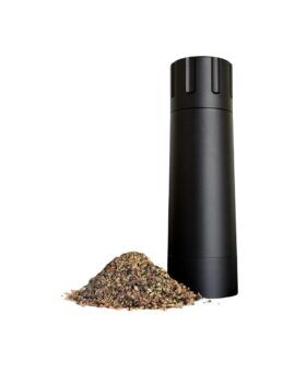 Black MannKitchen Pepper Cannon grinder beside a pile of coarsely ground pepper