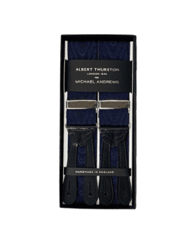Navy moire suspenders with silver hardware and black leather ends, in a gift box