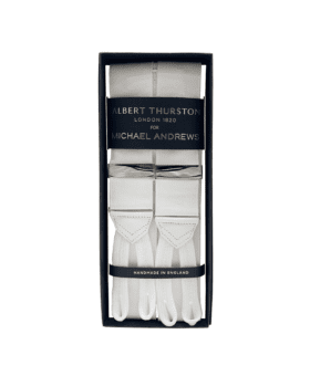 White solid suspenders with silver hardware and white leather ends, in a gift box