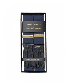 Navy solid suspenders with gold hardware and black leather ends, in a gift box