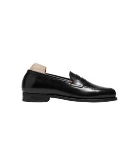 Black calf leather penny loafer with a leather sole and shoe tree, side product view