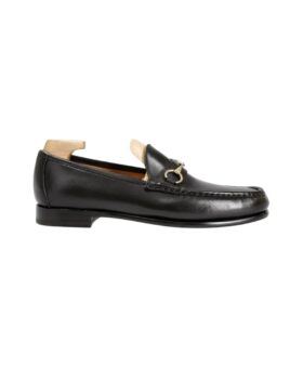 Black leather horsebit loafer with a moccasin toe and gold bit, side product view