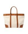 Natural canvas tote bag with tan leather trim, straps and handles, flat product view